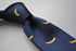 navy tie with yellow banana embroidered design